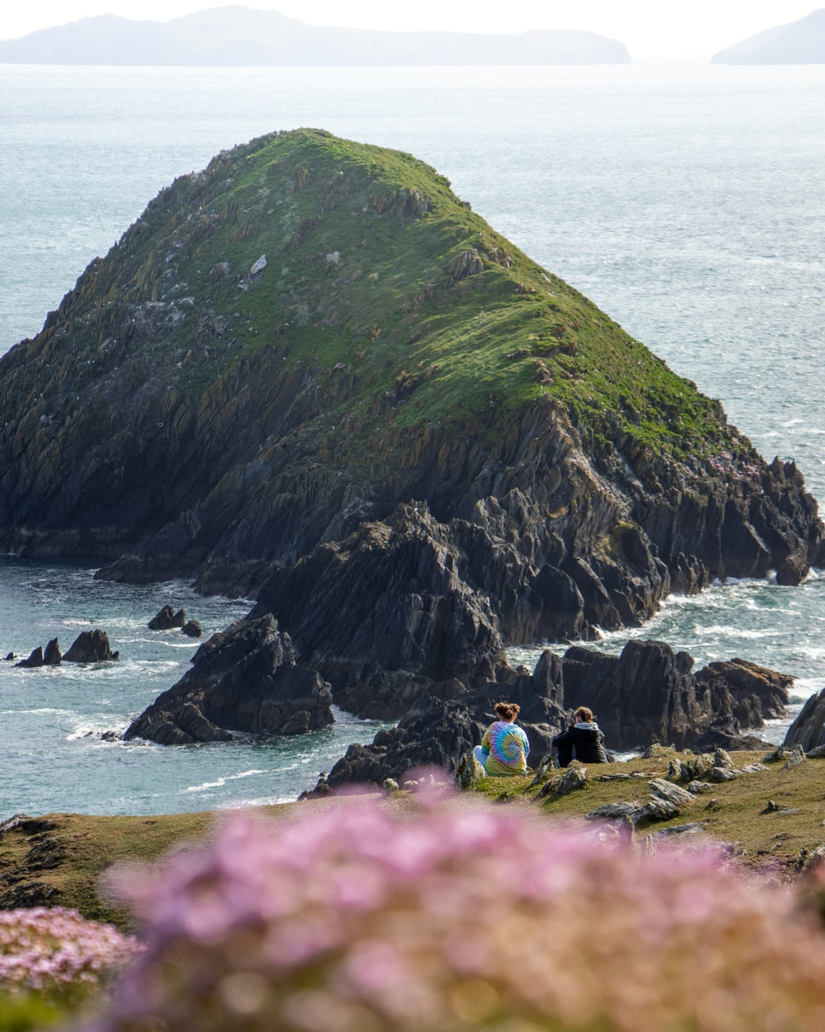 Two friends sitting above the sea on the Dingle Peninsula in County Kerry
